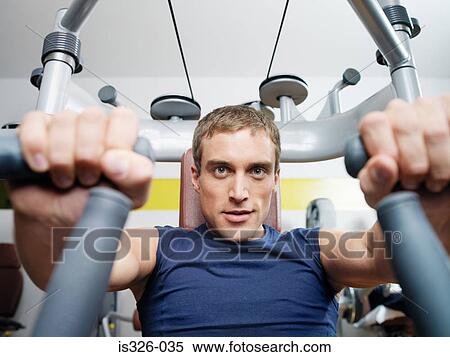 Stock Photography - Man weight training . Fotosearch