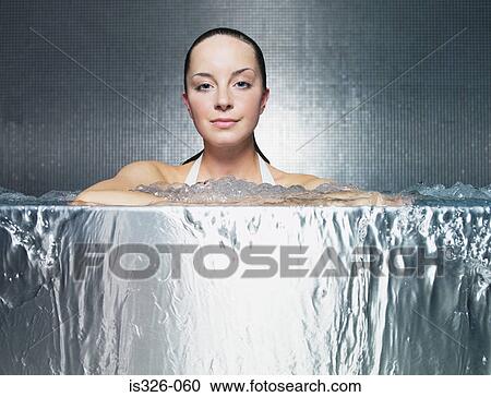 Woman immersing in jacuzzi  View Large Photo Image Stock Image - Woman immersing in jacuzzi . Fotosearch