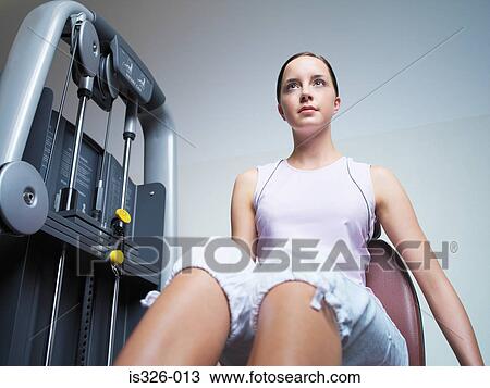 Stock Image - Woman weight training . Fotosearch