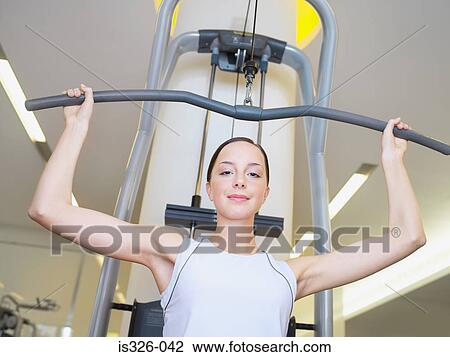 Woman weight training View Large Photo Image Stock Image - Woman weight training . Fotosearch