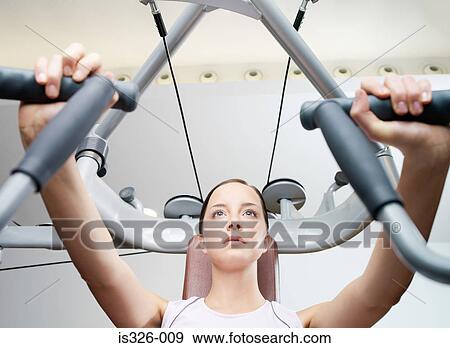 Woman weight training View Large Photo Image Stock Photo - Woman weight training . Fotosearch