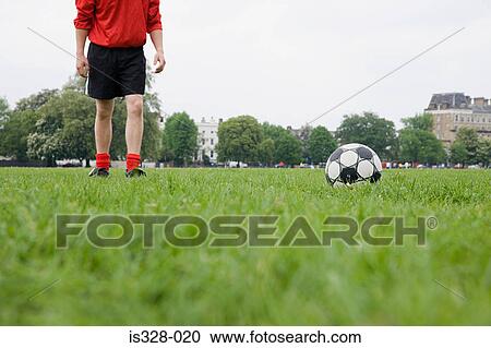 Footballer and football View Large Photo Image Stock Image - Footballer and football. Fotosearch