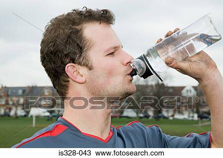 Footballer drinking water View Large Photo Image Stock Image - Footballer drinking water. Fotosearch