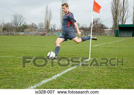 Footballer taking a corner kick View Large Photo Image Stock Photo - Footballer taking a corner kick. Fotosearch