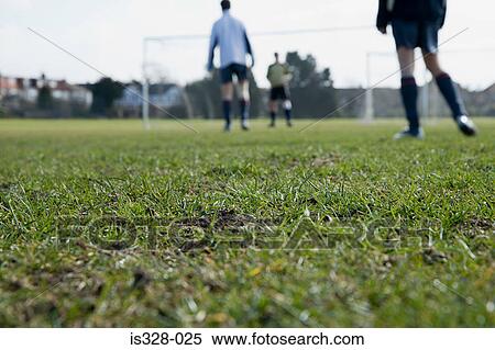 Footballers on a pitch View Large Photo Image Stock Photography - Footballers on a pitch. Fotosearch