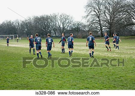 Footballers on the pitch View Large Photo Image Stock Photograph - Footballers on the pitch. Fotosearch