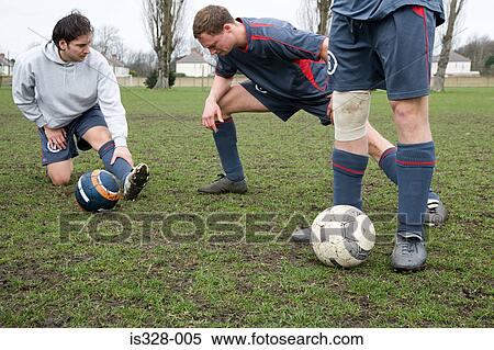 Stock Photography - Footballers warming up. Fotosearch