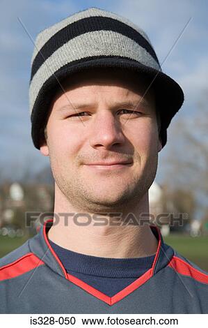 Stock Image - Man in a knit hat. Fotosearch