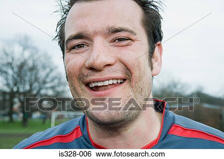 Smiling footballer View Large Photo Image Stock Photograph - Smiling footballer. Fotosearch