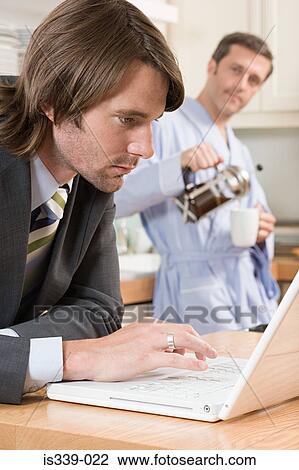 Stock Image - Gay couple at breakfast. Fotosearch