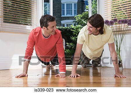 Stock Image - Gay couple exercising. Fotosearch
