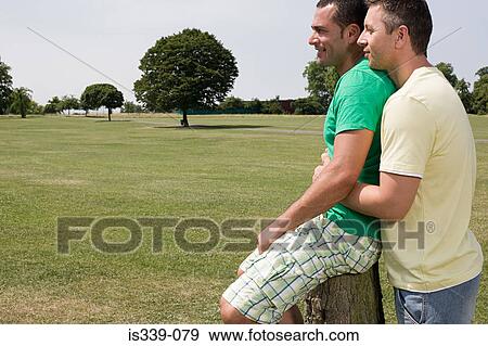 Gay couple hugging View Large Photo Image Stock Photo - Gay couple hugging. Fotosearch