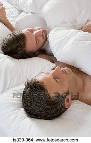 Picture - Gay couple in bed. Fotosearch