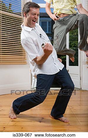 Stock Photo - Gay couple listening to music. Fotosearch