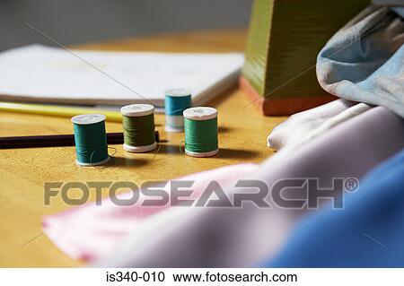 Cotton reels and fabric View Large Photo Image Stock Image - Cotton reels and fabric. Fotosearch