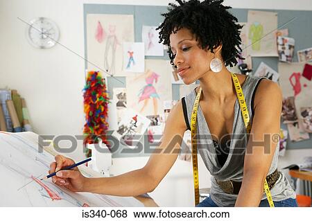 Fashion designer working View Large Photo Image Stock Photo - Fashion designer working. Fotosearch
