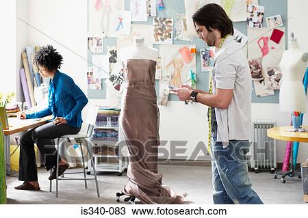 Fashion designers at work View Large Photo Image Stock Image - Fashion designers at work. Fotosearch