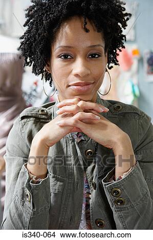 Picture - Serious young woman. Fotosearch