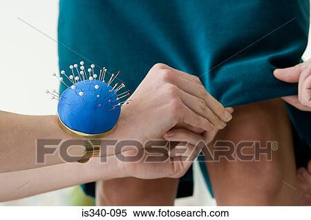Tailor pinning skirt View Large Photo Image Stock Photography - Tailor pinning skirt. Fotosearch
