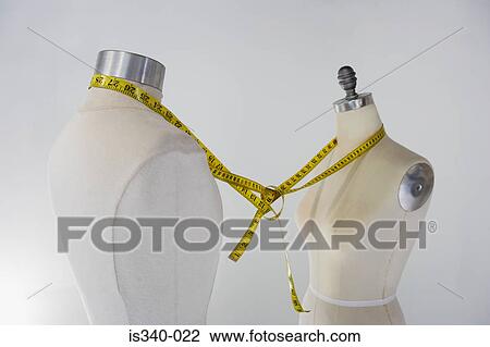 Tailors dummies tied together with tape measure View Large Photo Image Stock Image - Tailors dummies tied together with tape measure. Fotosearch