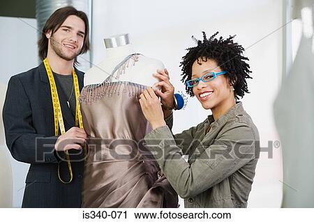 Tailors working on dress View Large Photo Image Stock Image - Tailors working on dress. Fotosearch