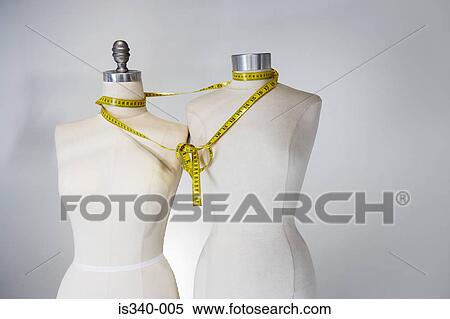 Tape measure tied around tailors dummies View Large Photo Image Stock Photography - Tape measure tied around tailors dummies. Fotosearch