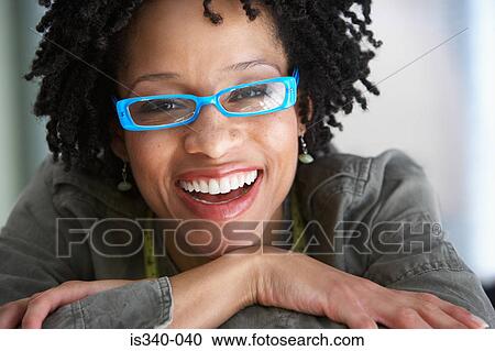 Stock Image - Woman wearing glasses. Fotosearch