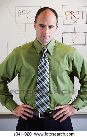Office worker with hand on hips View Large Photo Image Stock Image - Office worker with hand on hips. Fotosearch
