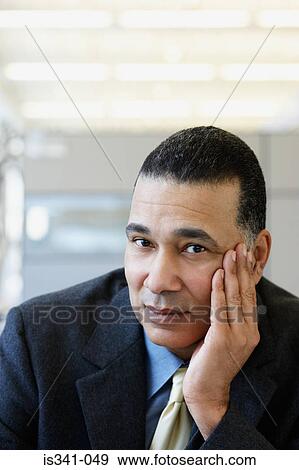 Pensive businessman View Large Photo Image Stock Photo - Pensive businessman. Fotosearch