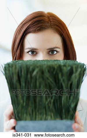 Woman holding pot plant View Large Photo Image Stock Image - Woman holding pot plant. Fotosearch