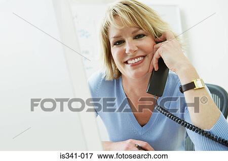Woman on telephone View Large Photo Image Stock Photo - Woman on telephone. Fotosearch
