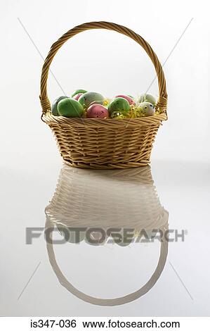 Basket of colourful eggs View Large Photo Image Stock Photograph - Basket of colourful eggs. Fotosearch