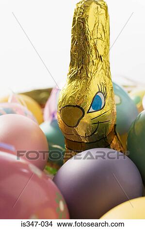 Rabbit and colourful eggs View Large Photo Image Picture - Rabbit and colourful eggs. Fotosearch
