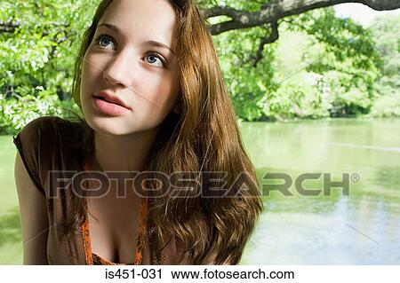 Teenage girl near a lake View Large Photo Image Stock Image - Teenage girl near a lake. Fotosearch