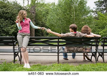 Teenage girl passing a note to boy View Large Photo Image Stock Image - Teenage girl passing a note to boy. Fotosearch