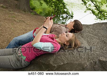 Teenage girl text messaging View Large Photo Image Stock Image - Teenage girl text messaging. Fotosearch