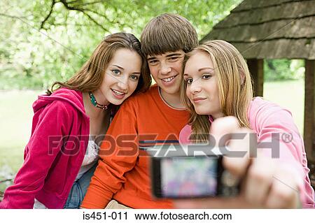 Teenagers posing for photographs View Large Photo Image Stock Image - Teenagers posing for photographs. Fotosearch