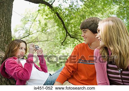 Teenagers posing for photographs View Large Photo Image Stock Image - Teenagers posing for photographs. Fotosearch