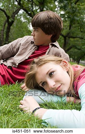 Teenagers relaxing in a park View Large Photo Image Stock Image - Teenagers relaxing in a park. Fotosearch