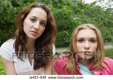 Two serious looking teenage girls View Large Photo Image Stock Photo - Two serious looking teenage girls. Fotosearch
