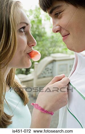 Young couple with bubble gum View Large Photo Image Stock Image - Young couple with bubble gum. Fotosearch