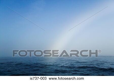 Rainbow fading over the ocean View Large Photo Image Stock Image - Rainbow fading over the ocean. Fotosearch