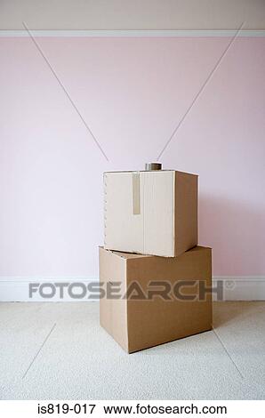 Cardboard boxes in sparse room View Large Photo Image Stock Photo - Cardboard boxes in sparse room. Fotosearch
