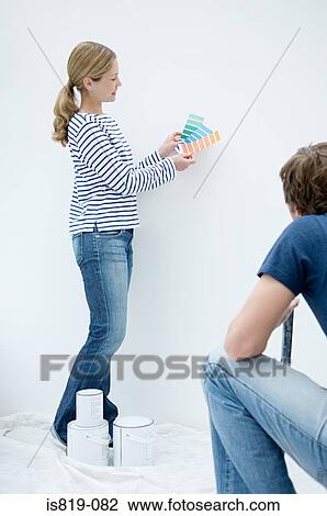 Couple choosing colours for wall View Large Photo Image Stock Image - Couple choosing colours for wall. Fotosearch