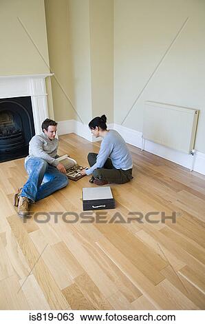Stock Image - Couple choosing fabric. Fotosearch