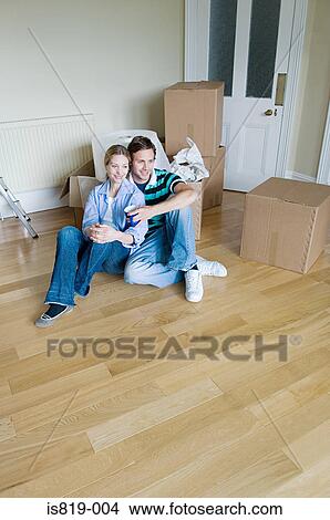 Couple in their new home View Large Photo Image Picture - Couple in their new home. Fotosearch
