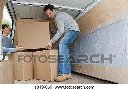 Couple moving house View Large Photo Image Stock Photo - Couple moving house. Fotosearch