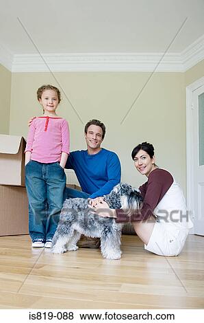 Family and dog in new house View Large Photo Image Stock Photo - Family and dog in new house. Fotosearch