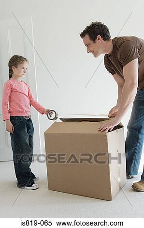 Father and daughter taping up box View Large Photo Image Stock Photography - Father and daughter taping up box. Fotosearch