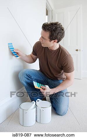 Man choosing paint colours View Large Photo Image Stock Photo - Man choosing paint colours. Fotosearch